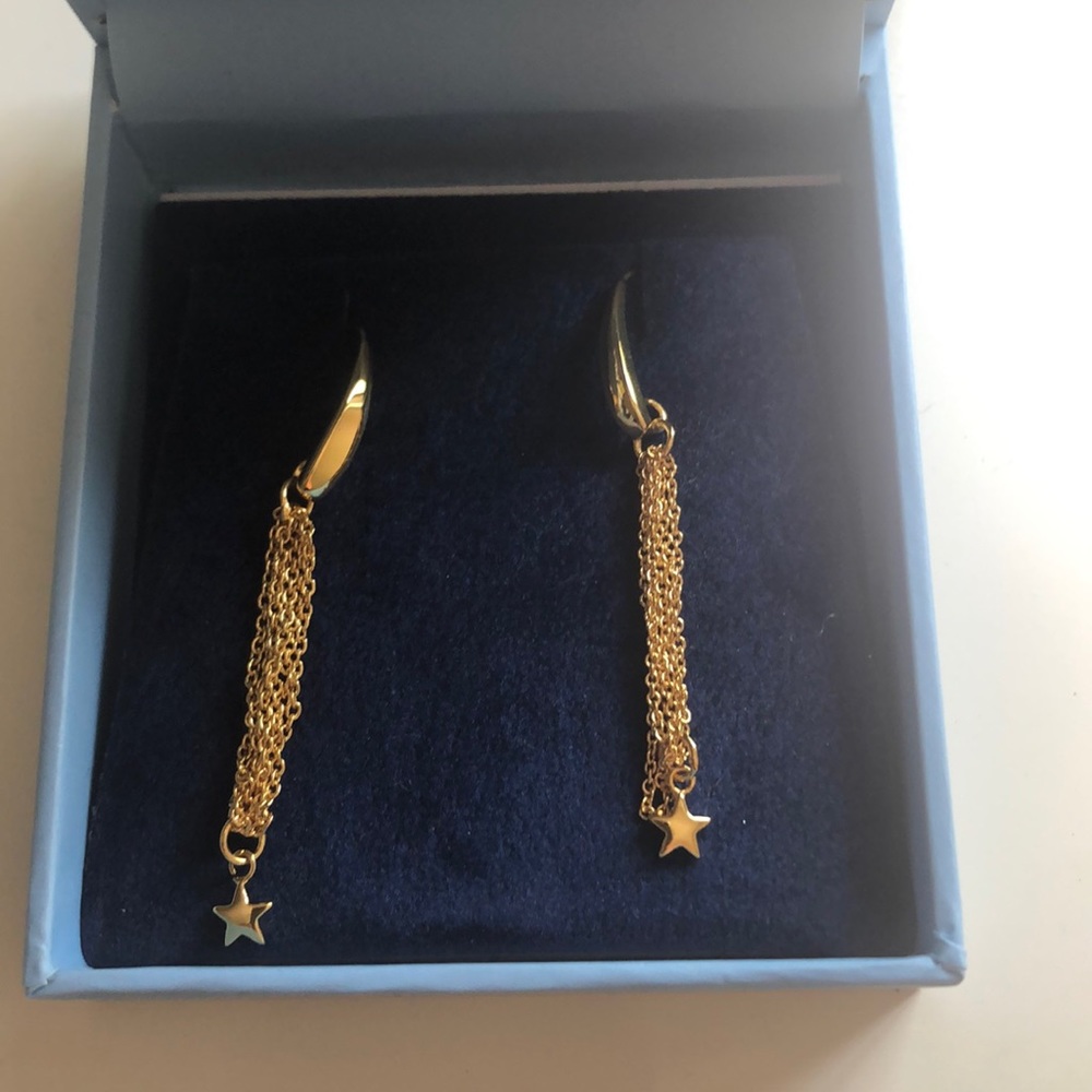 Stunning gold dangle star earrings